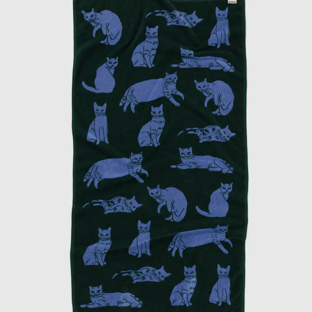 A bath towel featuring BAGGU's Cats design darker side shown