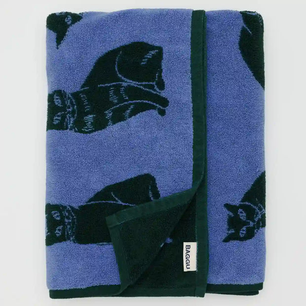 A bath towel featuring BAGGU's Cats design seen folded