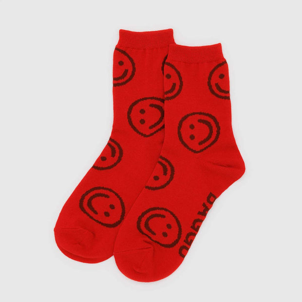 A pair of BAGGU crew socks in Red Happy