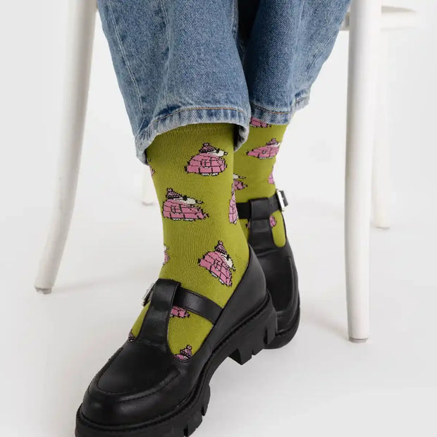 A person wearing a pair of BAGGU Crew Socks in Snoopy