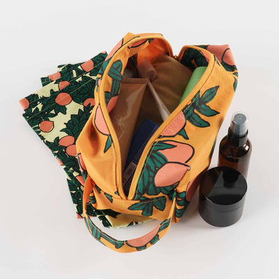 An Orange Tree Baggu Dopp Kit, shown open