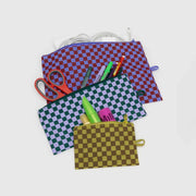 A BAGGU three Flat Pouch Set in Jewel Checks open with contents showing
