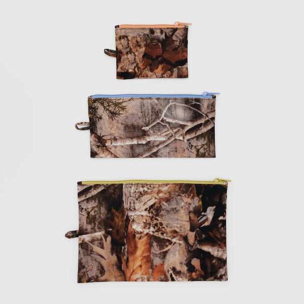 A BAGGU three Flat Pouch Set in Photo Forest laid flat