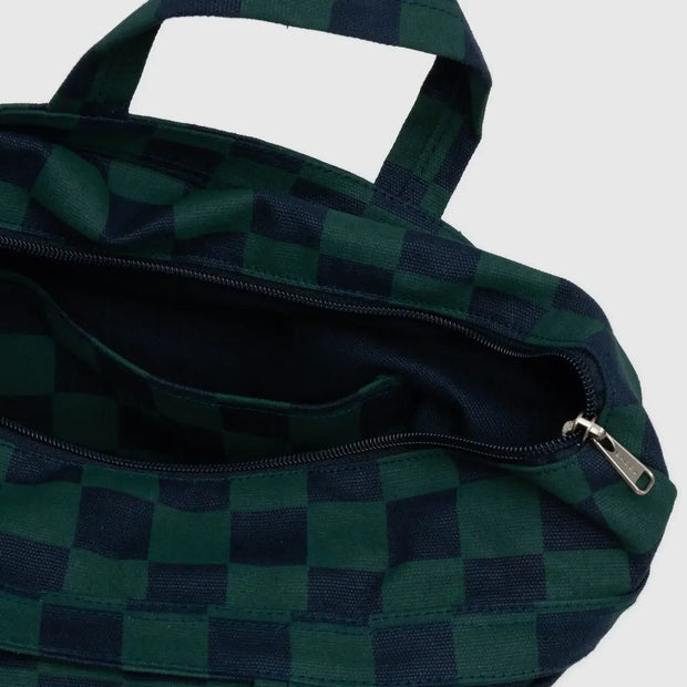 A close up of a horizontal zip duck bag from BAGGU in Navy Green Check