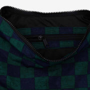 A close up of a medium Crescent Bag from BAGGU in Navy Green Check.