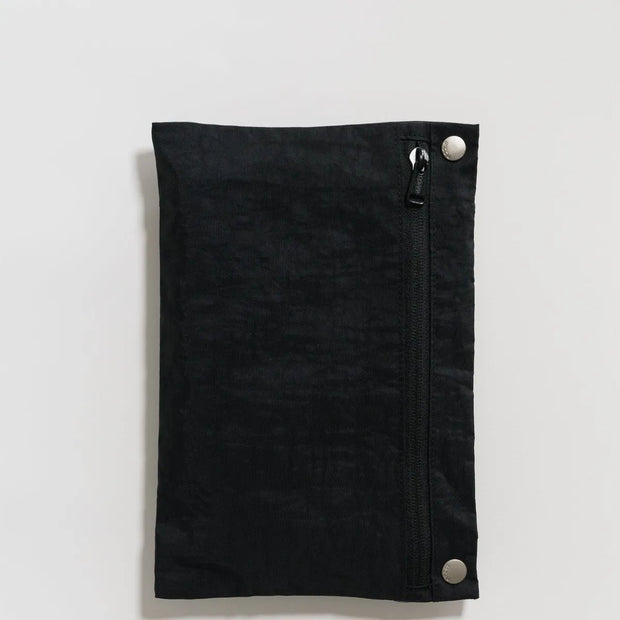 A BAGGU Travel Cloud bag, packed into its own pocket. Seen here in Black.