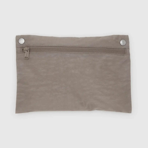 A BAGGU Travel Cloud bag in Dove, made from recycled heavyweight nylon in its pocket pouch