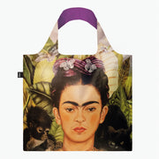 A recycled reusable bag from LOQI featuring the Self Portrait with Hummingbird artwork from Frida Kahlo.