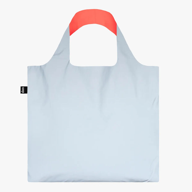 A Neon Dark Orange Reflective Bag from LOQI in daylight