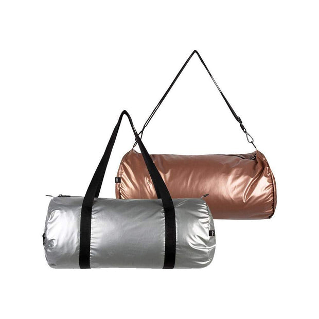 A silver and rose gold reversible weekender bag from LOQI