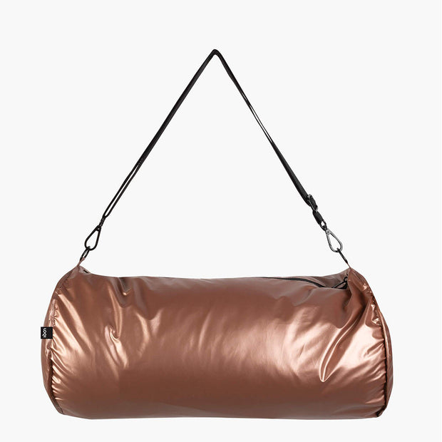 A silver and rose gold reversible weekender bag from LOQI shown from the rose gold side